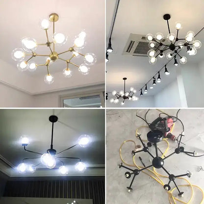 Modern brass and black glass ball pendant chandelier with branching metal frame and clear glass ball bulbs for dining room decorbites glass ball
