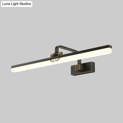 Modern brass and black led wall sconce with warm color temperature and geometric detailing for dressing table vanity