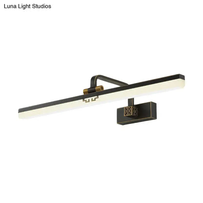 Modern brass and black led wall sconce with sleek rectangular panel providing warm color temperature for dressing table