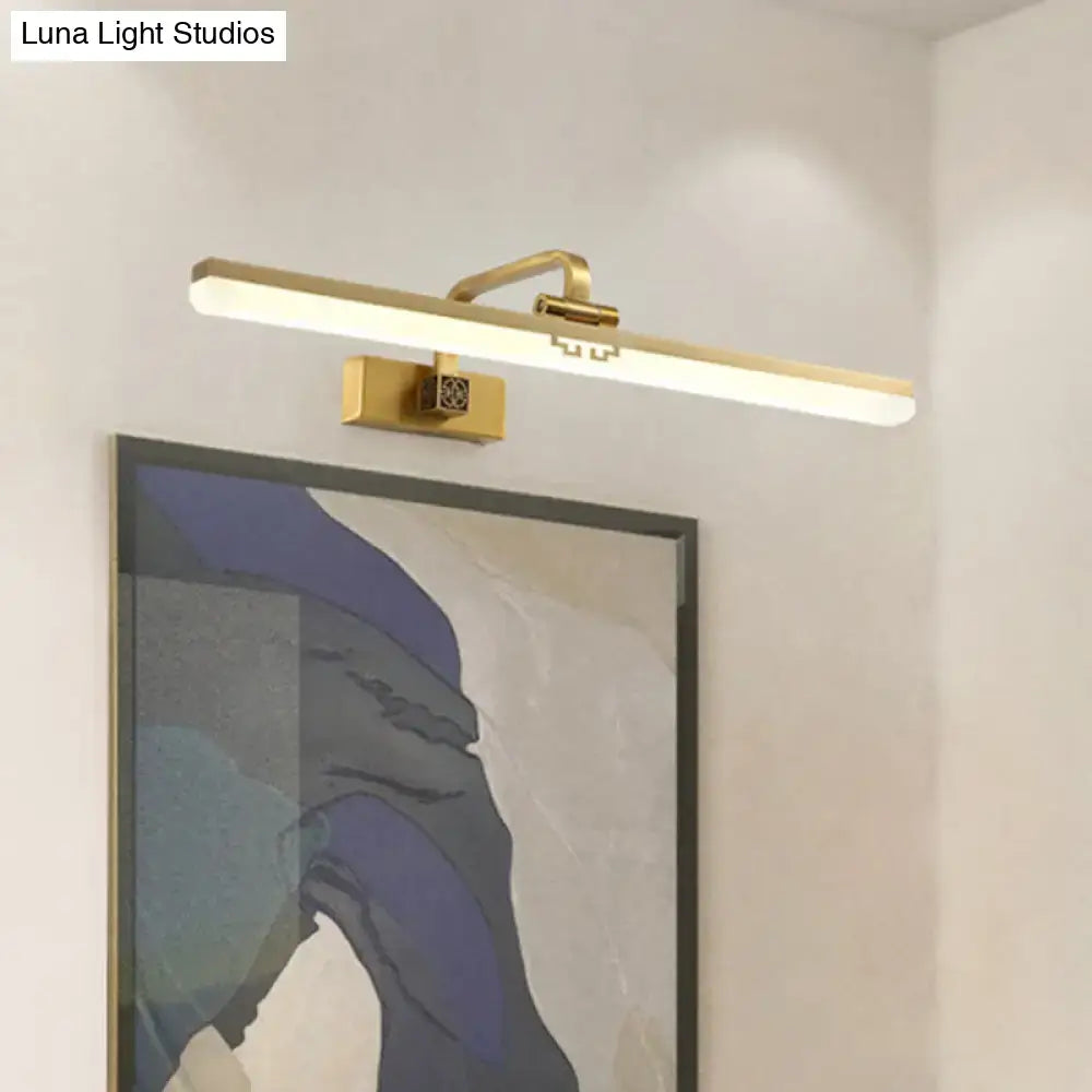 Modern brass and black wall sconce with gold finish and integrated led lighting for dressing table warm color temperature
