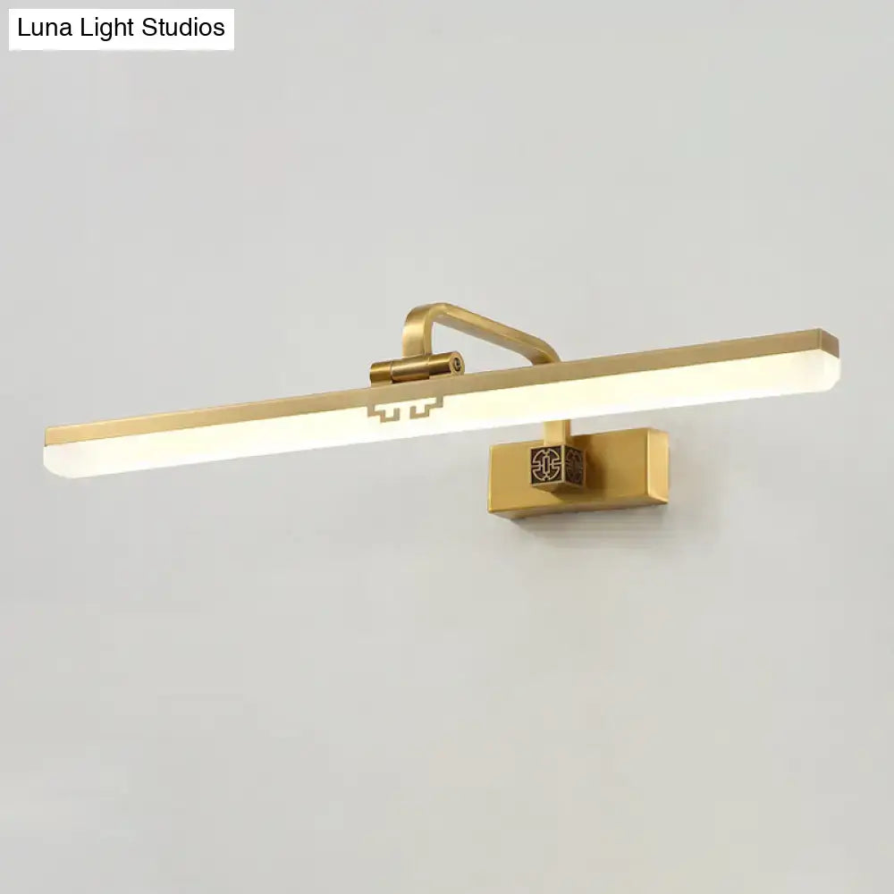 Modern brass and black wall sconce with gold finish, rectangular led bar, and warm color temperature for dressing table