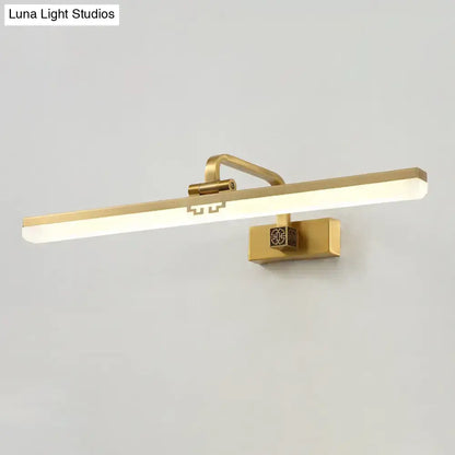 Modern brass and black wall sconce with gold finish, rectangular led bar, and warm color temperature for dressing table