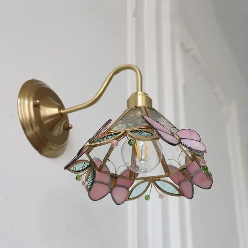 Delicate modern brass wall sconce with pink and blue stained glass butterfly shade for bedroom decorbites clear glass lighting