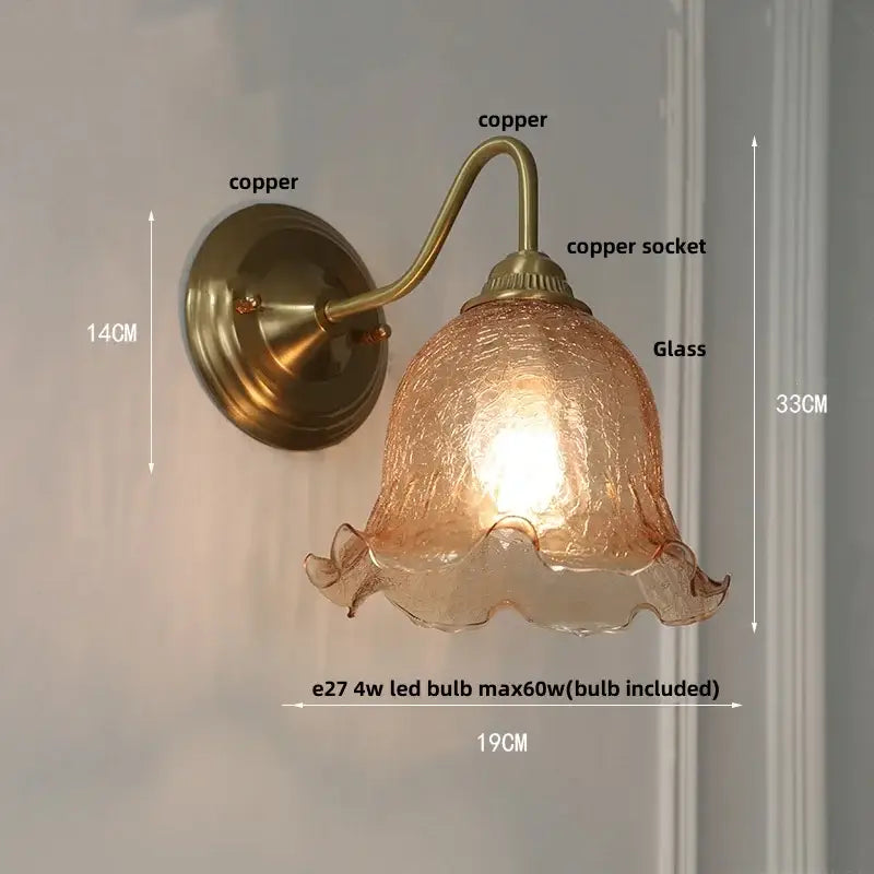 Copper-finished wall sconce with amber-tinted textured glass shade and ruffled edges by decorbites clear glass