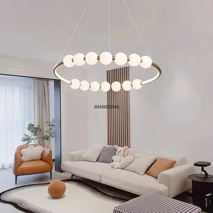 Modern brass circle ring led pendant light with gold-toned metal frame and frosted glass globes by decorbites circle ring