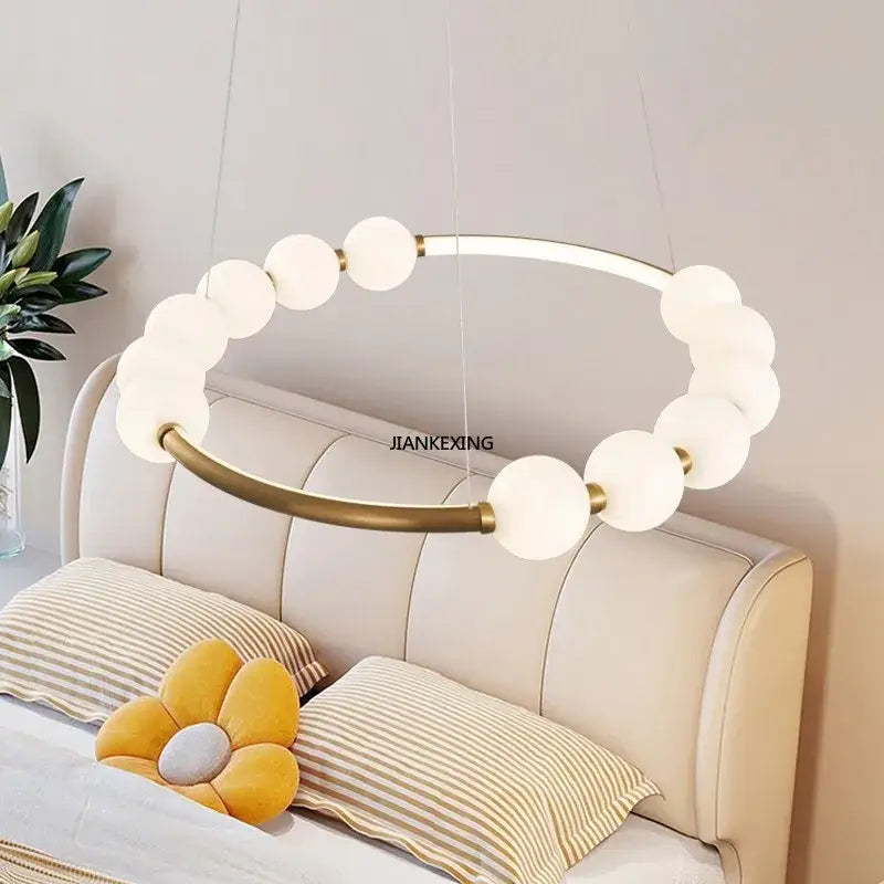 Modern brass circle ring led pendant light with frosted white spherical bulbs and metal frame for dining room decorbites circle ring