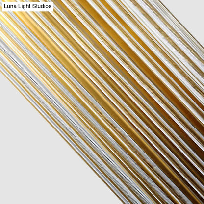 Modern brass clear crystal wall lamp featuring shiny gold and silver metallic rods arranged diagonally for bedroom sconce