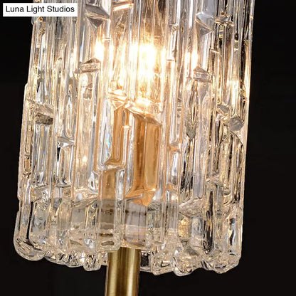 Modern brass clear glass sconce with faceted crystal and gold-toned metal base for living room 12 inch fixture