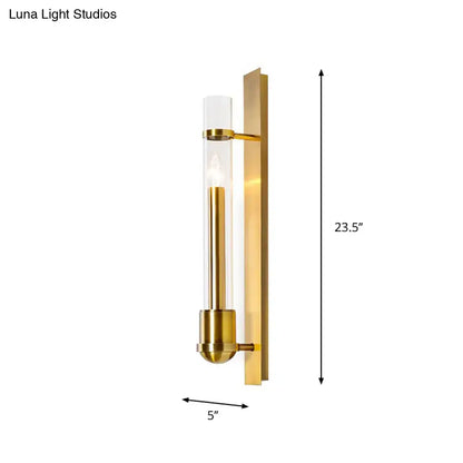 Modern brass clear glass wall sconce light fixture with brushed brass finish and clear glass cylinder housing led bulb