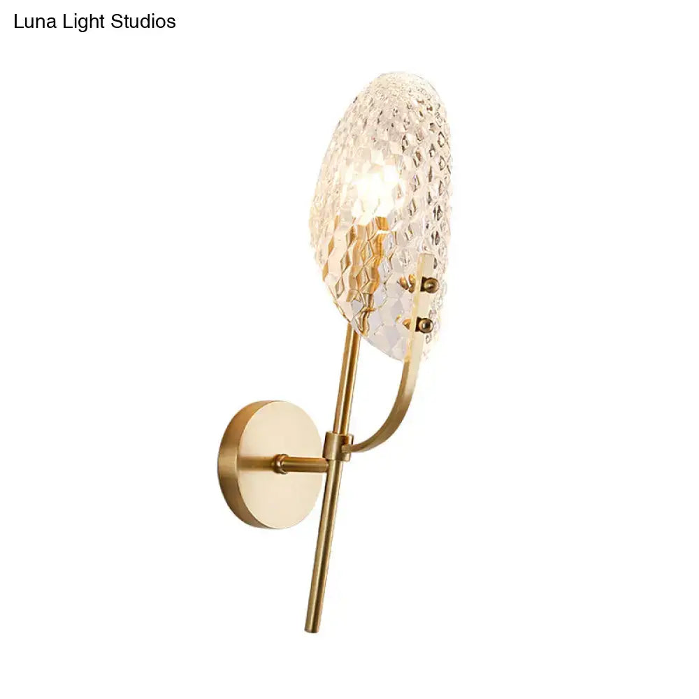 Modern brass crystal beveled light fixture hallway sconce with gold-toned wall sconce and textured faceted crystal shade