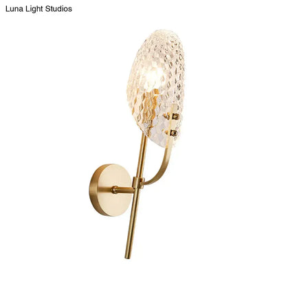 Modern brass crystal beveled light fixture hallway sconce with gold-toned wall sconce and textured faceted crystal shade
