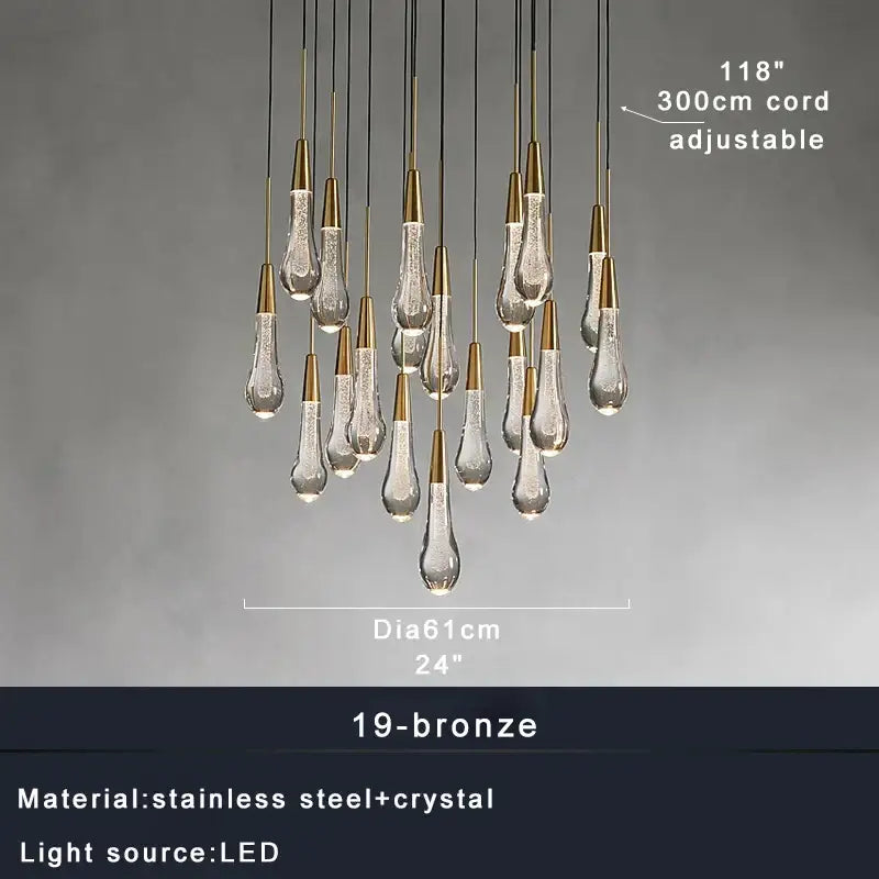 Modern brass crystal ceiling pendant light with teardrop-shaped crystal pendants on bronze-finished cords