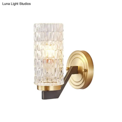 Modern brass crystal flush wall sconce with a clear faceted glass cylinder and gold-toned metal base wall lamp