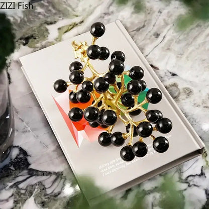 Modern brass crystal grape cluster brooch with gold-toned metal and glossy black spherical beads for decor use