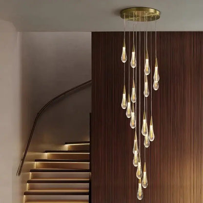 A modern brass crystal led chandelier with clear glass teardrop pendant lights for dining room decorbites crystal led