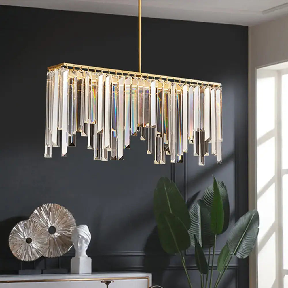 Modern brass crystal led island light with gold frame and cascading clear crystal prisms for dining room island light