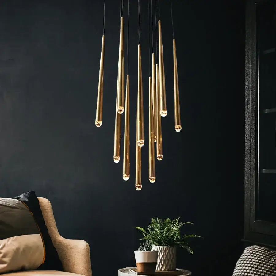 Modern brass crystal led pendant chandelier featuring slender tapered rods and warm bulbs for villa stairs decorbites crystal led