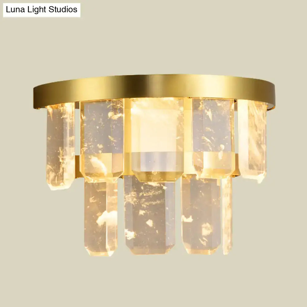Modern style sconce light with gold-toned brass finish and clear faceted crystal pendants featuring smd led bulb