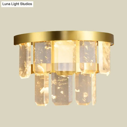Modern style sconce light with gold-toned brass finish and clear faceted crystal pendants featuring smd led bulb