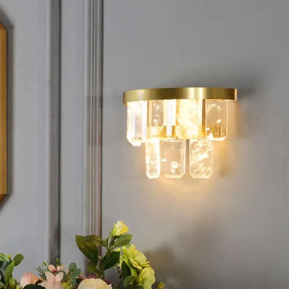 Modern brass crystal sconce light with gold metal frame and cascading clear shades featuring smd led bulb modern style