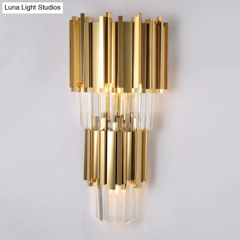 Gold-toned modern wall lamp with vertical brass rods and clear crystal prisms direct wired electric for living room