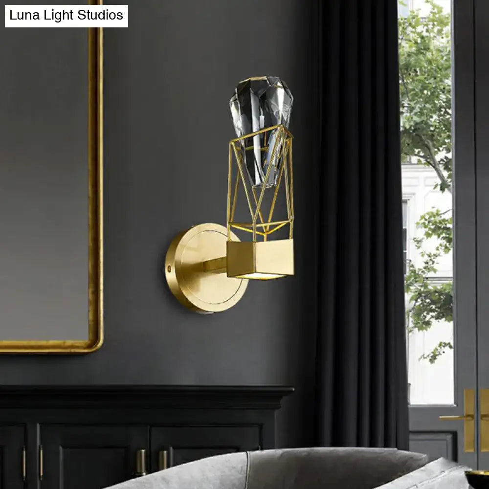 Modern brass crystal rock wall sconce with gold-toned geometric design and faceted crystal accent for bedroom fixture width