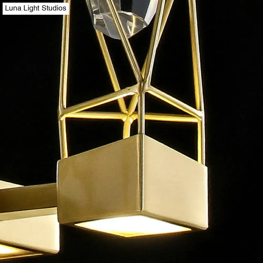 Modern brass crystal rock wall sconce featuring a gold-toned geometric fixture with faceted crystal pendant and square light fixture width