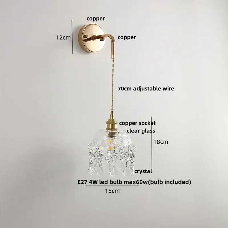 Modern brass crystal wall lamp with delicate copper finish clear glass shade and dangling crystal droplets by decorbites clear glass