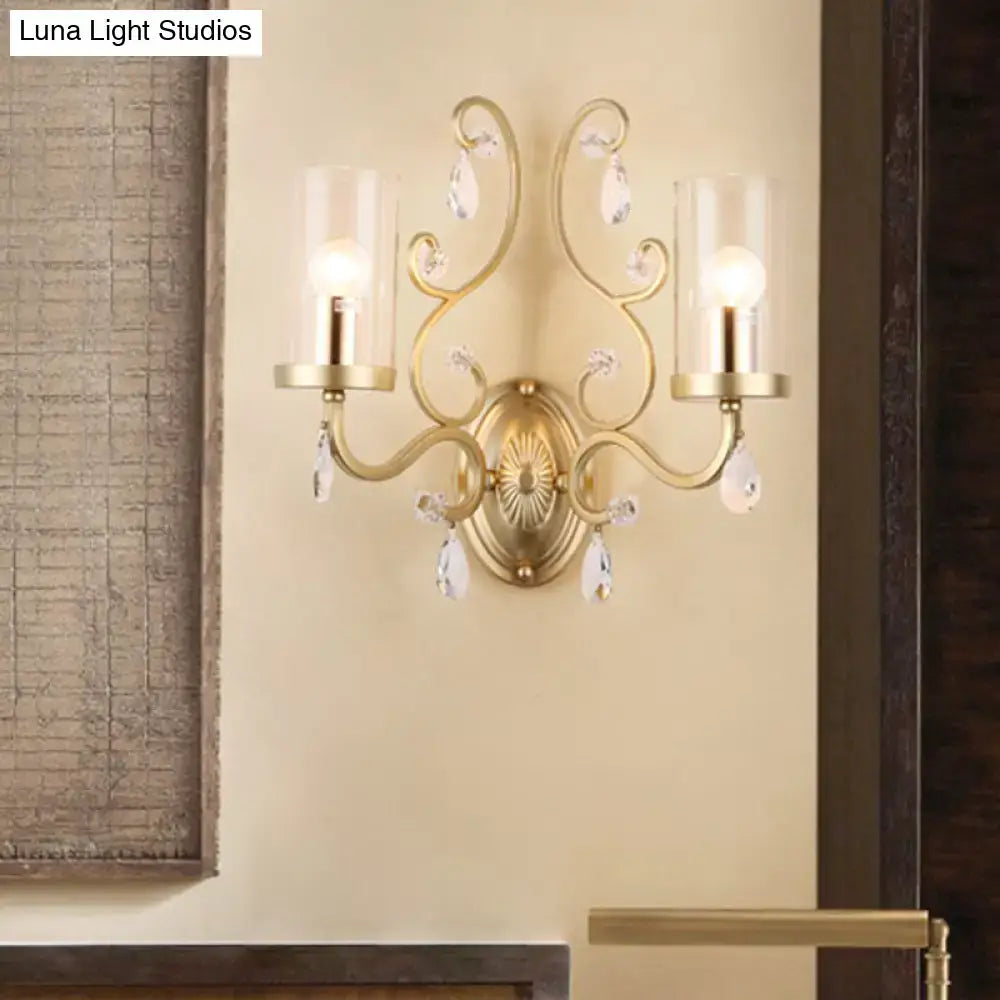 Modern brass crystal wall mounted light with gold-toned ornate design and clear glass shades for bedroom use