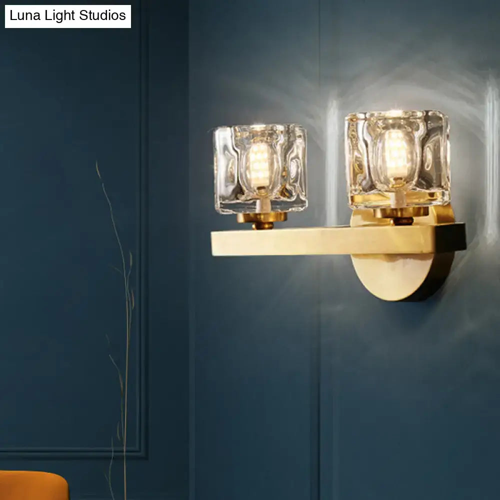 Modern brass crystal wall sconce with gold-toned textured glass cubes and warm led bulbs for contemporary cube flush lighting