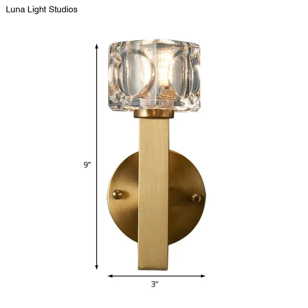 Modern brass crystal wall sconce with faceted glass shade and brass stem for contemporary cube flush lighting