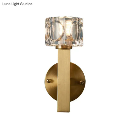 Modern brass crystal wall sconce with faceted shade and sleek metal stem for contemporary cube flush wall lighting