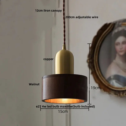 Modern brass and dark wood led wood pendant light with brass copper top and adjustable braided wire suspension for dining room decorbites led wood
