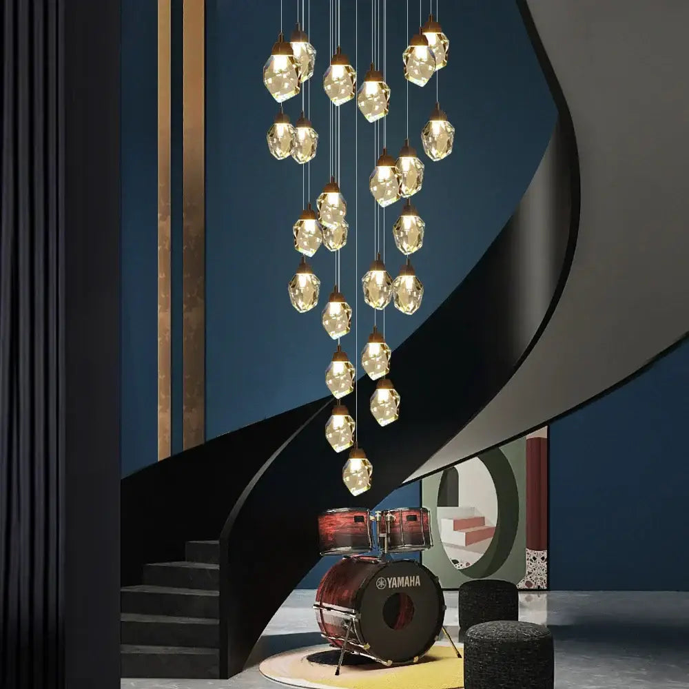 A modern brass decorbites crystal led chandelier with multiple clear faceted crystal pendants for living room lighting