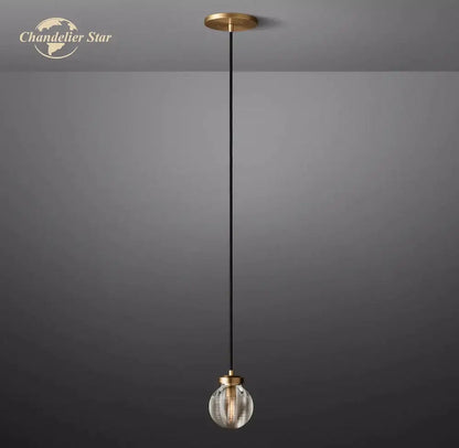 Modern brass decorbites crystal pearl pendant light with gold ceiling mount and clear vertical ridged glass globe shade