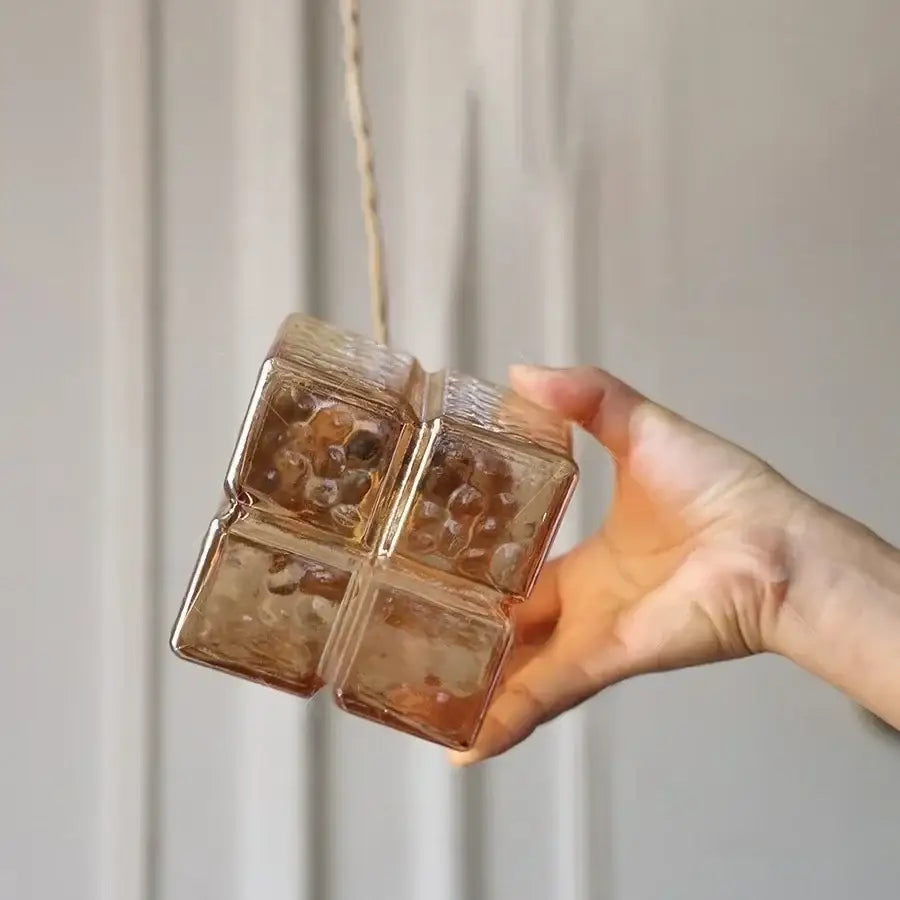 Modern brass decorbites cube amber glass pendant lamp with translucent textured amber glass and four square compartments