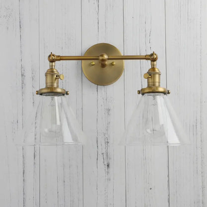 Modern brass decorbites funnel glass wall sconce with two clear glass conical shades wall-mounted light fixture