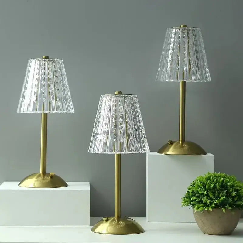 Three elegant modern brass diamond touch desk lamps with clear faceted glass shades for bedroom lighting