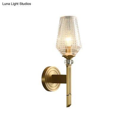 Modern brass diamond wall light featuring a lattice glass shade with crystal accent for bedroom lighting