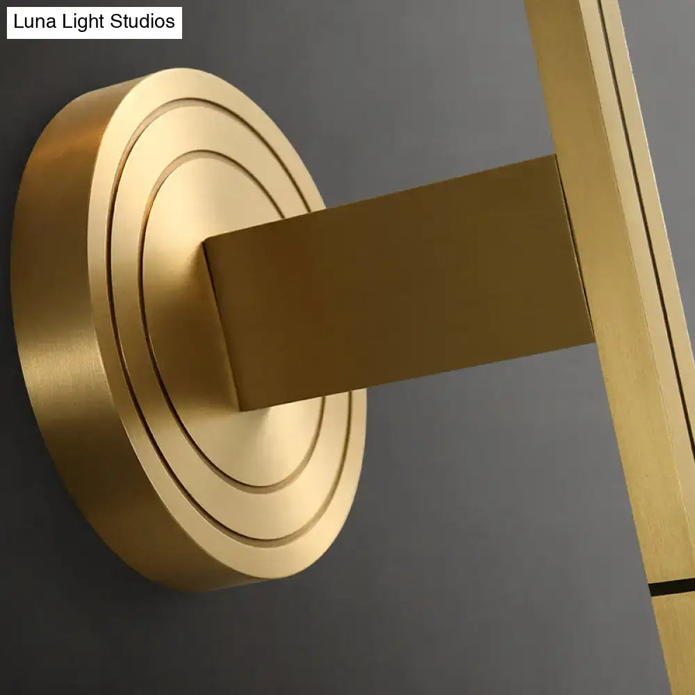 Modern brass diamond wall light with lattice glass shade featuring gold-toned brass and concentric circular rings