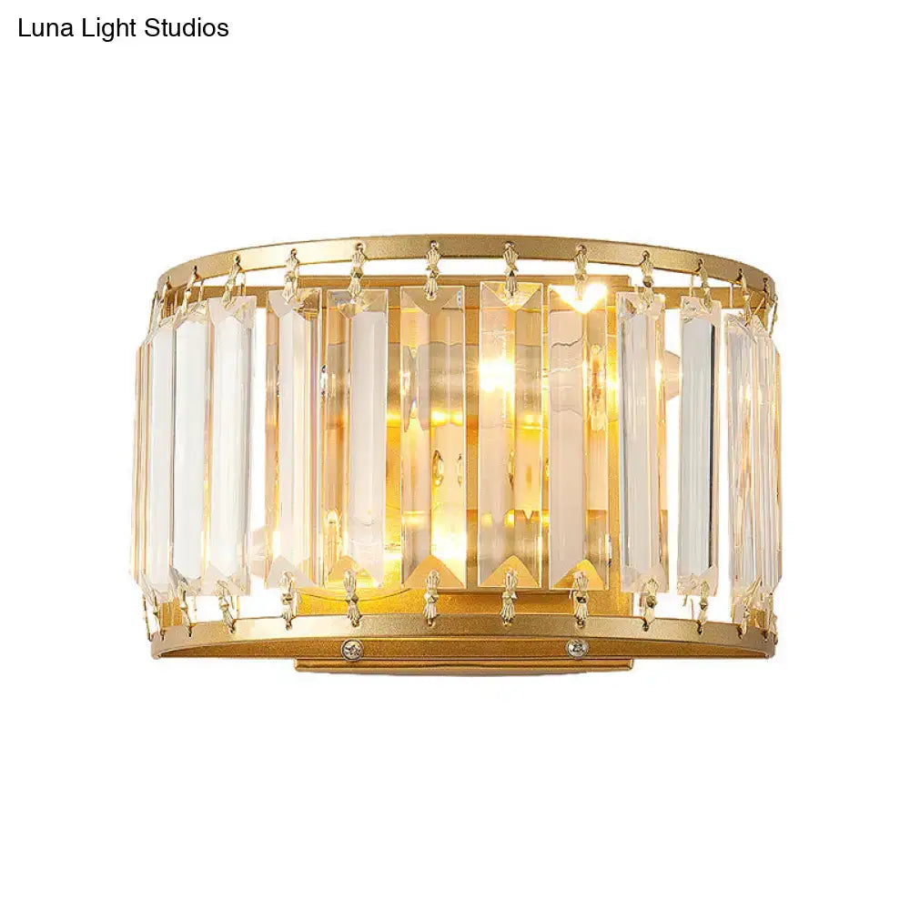 Modern brass drum shaped wall sconce with gold finish vertical crystal prisms and dangling clear crystals for e12 e14 bulb
