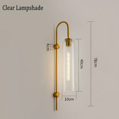 Modern brass e27 glass wall light with gold-toned finish and clear glass shade for bedroom sconce lighting