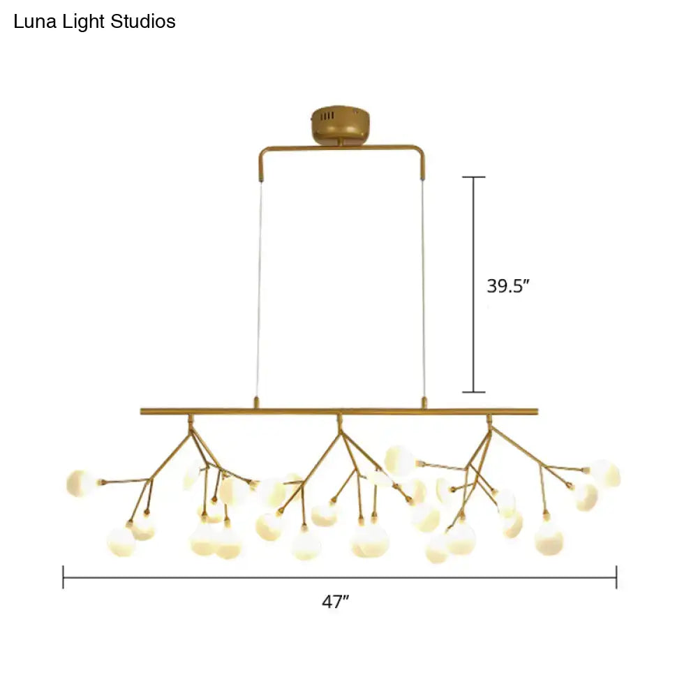 Gold-toned decorbites 27-bulb island light with brass finish and frosted glass globes compatible with 220v-240v and 110v-120v