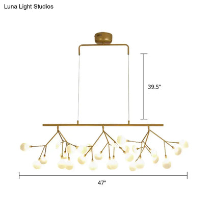 Gold-toned decorbites 27-bulb island light with brass finish and frosted glass globes compatible with 220v-240v and 110v-120v