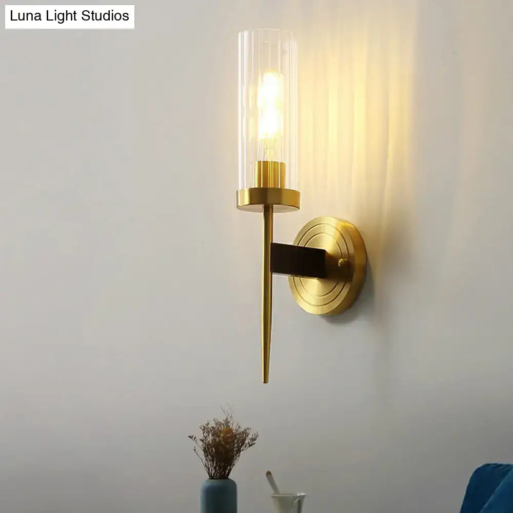 Modern brass finish glass tube wall light with gold-toned cylindrical glass shade for living room wall light