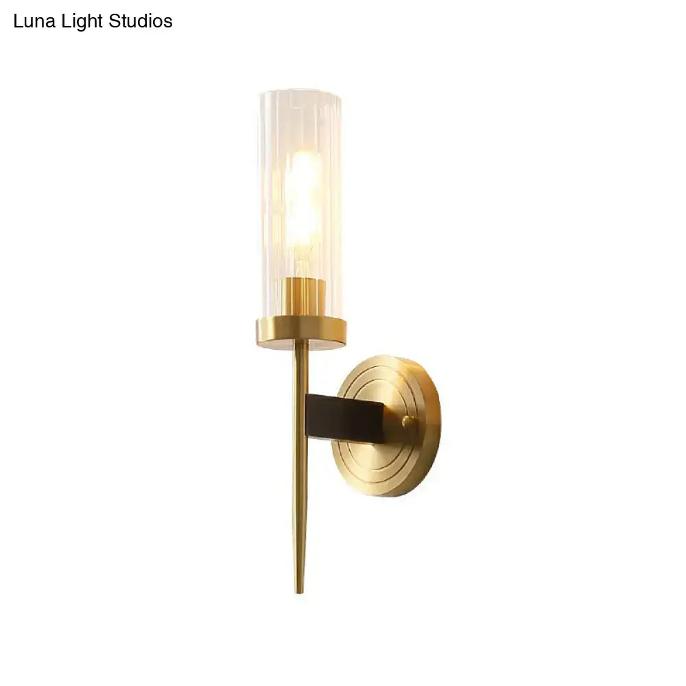 Modern brass finish glass tube wall light with cylindrical frosted glass shade for living room use