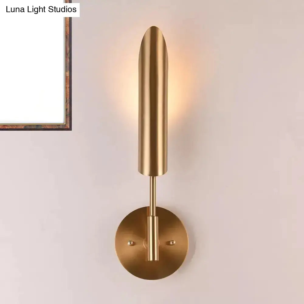 Modern brass finish led wall lamp with a sleek cylindrical shade and circular base for bedroom 220v-240v 110v-120v use