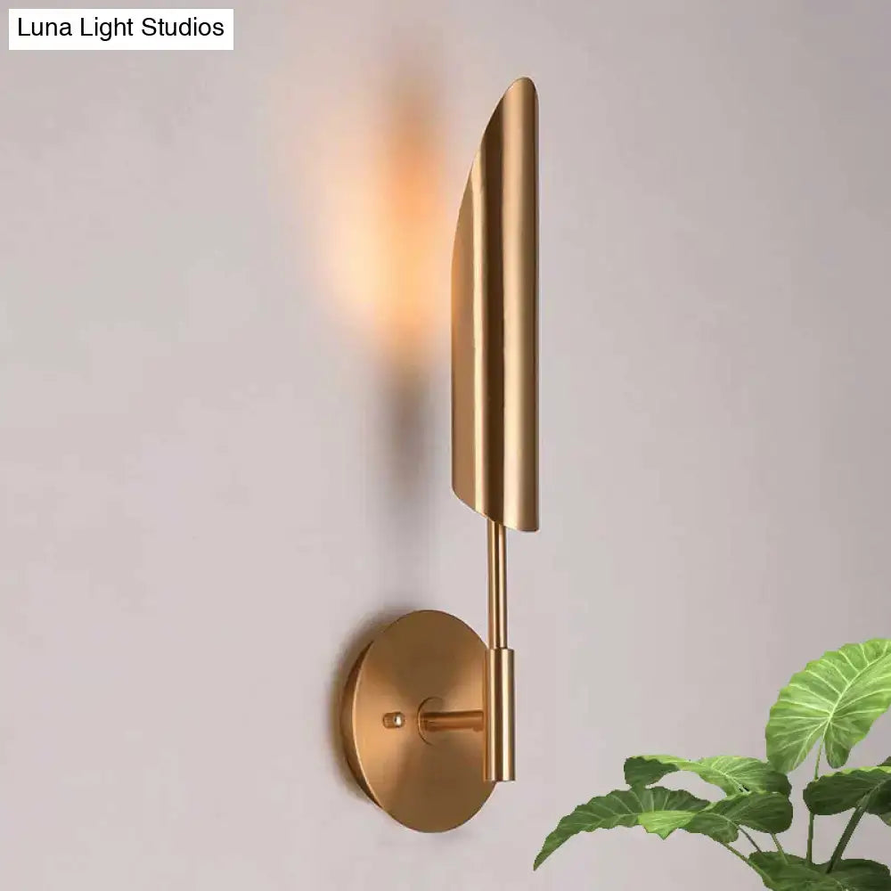 A sleek brass finish led wall lamp in brushed gold shaped like a leaf designed for bedroom 220v-240v 110v-120v use
