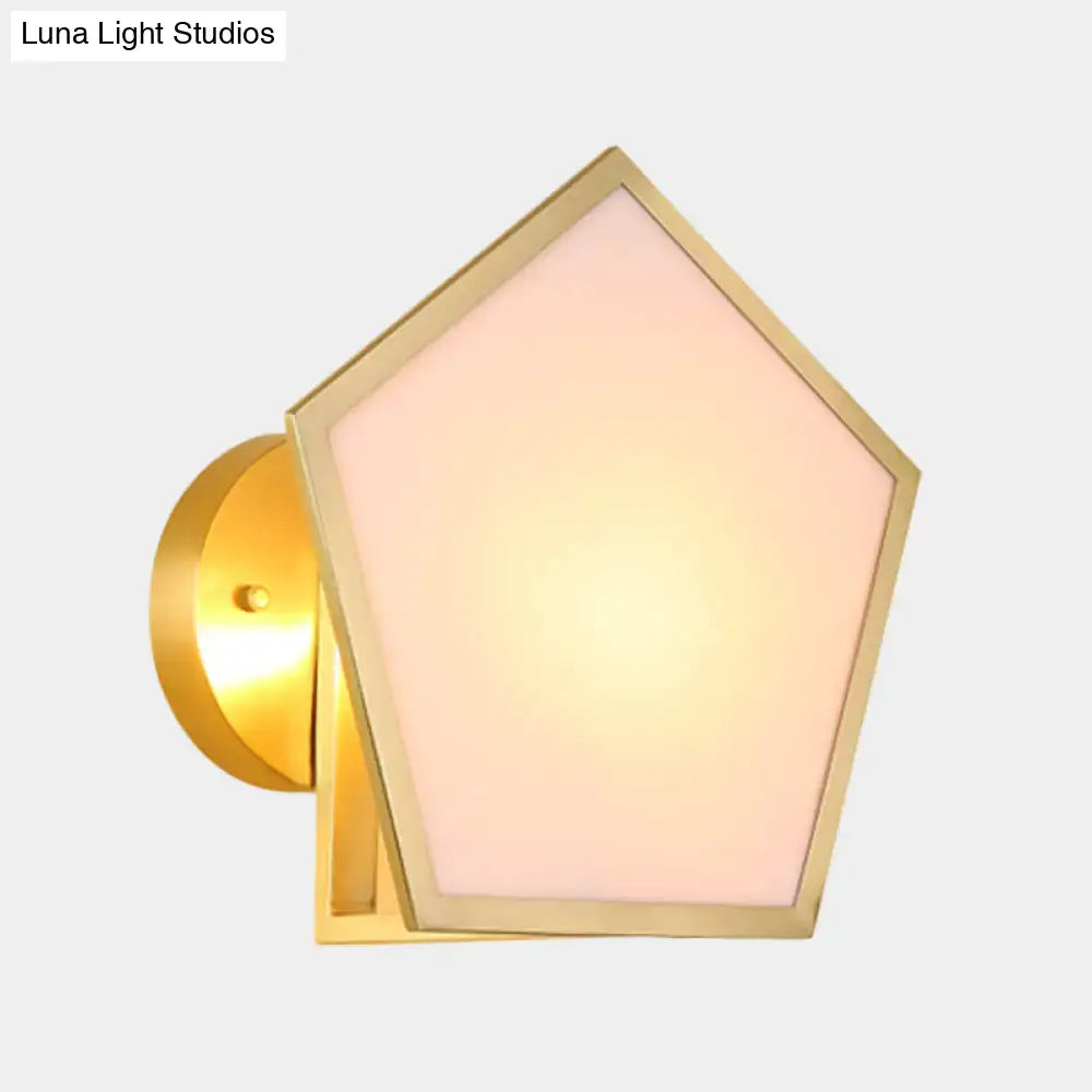 Modern brass finish pentagon wall lamp with gold-toned metal wall sconce and soft pink frosted glass panel