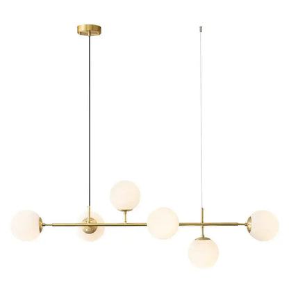 Modern brass pendant light with five frosted golden glass ball shades for dining room illumination